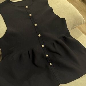 Elegant Black Sleeveless Top with Pearl Buttons